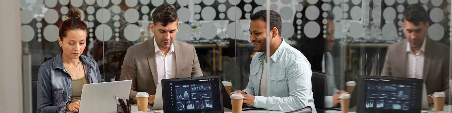 Professional software development team assessing website strategy and project requirements
